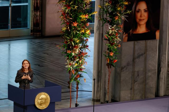 Ana Corina Sosa, daughter of Venezuelan opposition leader Maria Corina Machado, speaks after receiving the Nobel Peace Prize for her mother at the Nobel Peace Prize ceremony at Oslo City Hall on December 10, 2025 in Oslo, Norway. The 2025 Nobel Peace Prize was awarded to Machado for her efforts to bring democracy to Venezuela, challenging the iron-fisted rule of Venezuelan President Nicolas Maduro, who has been president since 2013. (Photo by Odd ANDERSEN / AFP)