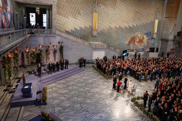 Ana Corina Sosa, daughter of Venezuelan opposition leader Maria Corina Machado, receives a standing ovation following her speach after receiving the Nobel Peace Prize for her mother at the Nobel Peace Prize ceremony at Oslo City Hall on December 10, 2025 in Oslo, Norway. The 2025 Nobel Peace Prize was awarded to Machado for her efforts to bring democracy to Venezuela, challenging the iron-fisted rule of Venezuelan President Nicolas Maduro, who has been president since 2013. (Photo by Odd ANDERSEN / AFP)