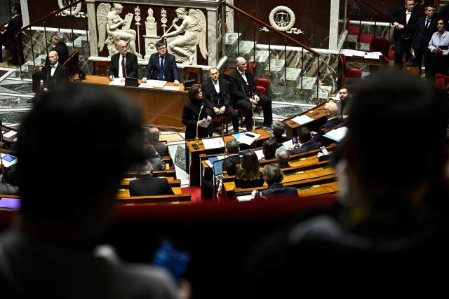 France's Culture Minister Rachida Dati (C) answers during a session of questions to the government at the National Assembly, France's lower house parliament, in Paris on December 10, 2025. (Photo by JULIEN DE ROSA / AFP)