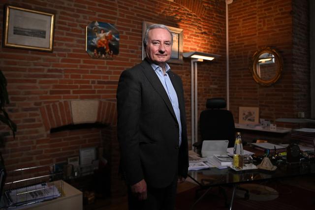 Toulouse's Mayor Jean-Luc Moudenc of Les Republicains (LR) party, poses in his office during a photo session in Toulouse, south-western France on December 10, 2025. (Photo by Valentine CHAPUIS / AFP)