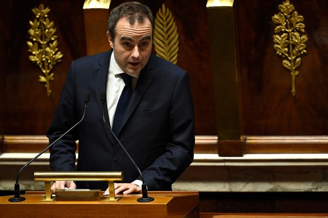 France's Prime Minister Sebastien Lecornu speaks during a government statement on national defence strategy at the National Assembly, France's lower house parliament, in Paris on December 10, 2025. (Photo by JULIEN DE ROSA / AFP)
