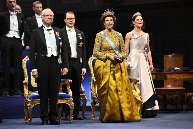 (L-R) Sweden's King Carl Gustaf, Prince Daniel, Queen Silvia and Crown Princess Victoria attend the 2025 Nobel Prize ceremony at the Concert Hall in Stockholm, Sweden, December 10, 2025. The laureates received their prizes at formal ceremonies in Stockholm and Oslo on December 10. That date is the anniversary of the death in 1896 of scientist Alfred Nobel, who created the prizes in his will. (Photo by Henrik Montgomery/TT / TT News Agency / AFP) / Sweden OUT