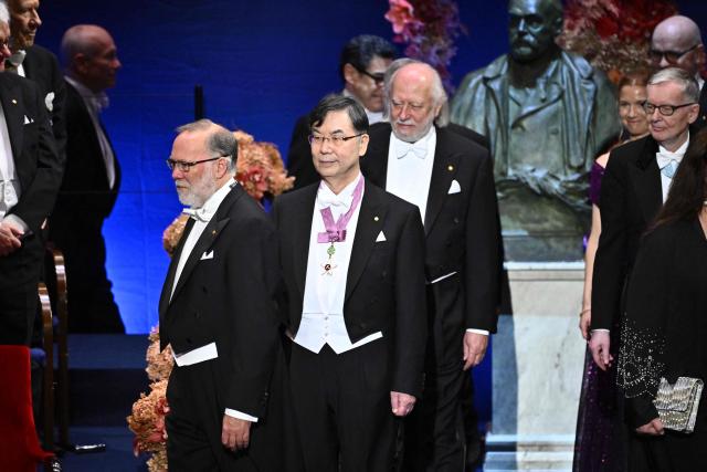 (L-R) Nobel Prize in Physiology or Medicine 2025 laureate US immunologist Fred Ramsdell, Nobel Prize in Physiology or Medicine 2025 laureate Japanese immunologist Shimon Sakaguchi and Nobel Prize in Literature 2025 laureate Hungarian writer Laszlo Krasznahorkai arrive for the award ceremony on December 10, 2025 in Stockholm, Sweden. The laureates received their prizes at formal ceremonies in Stockholm and Oslo on December 10. That date is the anniversary of the death in 1896 of scientist Alfred Nobel, who created the prizes in his will. (Photo by Anders WIKLUND / TT NEWS AGENCY / AFP) / Sweden OUT