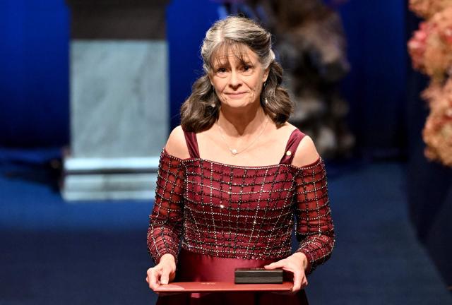 Nobel Prize in Physiology or Medicine 2025 laureate US molecular biologist and immunologist Mary E Brunkow poses with her award during the Nobel Prize award ceremony on December 10, 2025 in Stockholm, Sweden. The laureates will receive their prizes at formal ceremonies in Stockholm and Oslo on December 10. That date is the anniversary of the death in 1896 of scientist Alfred Nobel, who created the prizes in his will. (Photo by Jonathan Nackstrand / AFP)