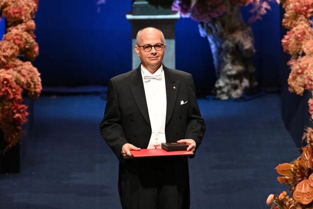 Nobel Prize in Chemistry 2025 laureate US-Jordanian chemist Omar M. Yaghi poses with his award during the award ceremony on December 10, 2025 in Stockholm, Sweden. The laureates received their prizes at formal ceremonies in Stockholm and Oslo on December 10. That date is the anniversary of the death in 1896 of scientist Alfred Nobel, who created the prizes in his will. (Photo by Jonathan Nackstrand / AFP)