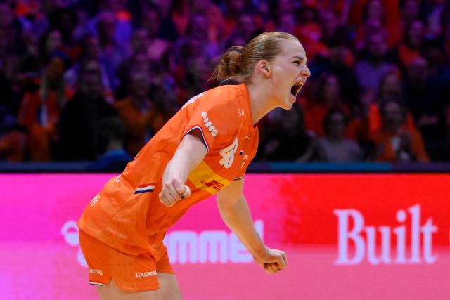 Netherlands' right back #48 Dione Housheer celebrates after scoring during the quarter finals match between the Netherlands and Hungary of the IHF Women's Handball World Championship in Rotterdam Ahoy, in Rotterdam on December 10, 2025. (Photo by JOHN THYS / AFP)