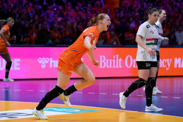 Netherlands' right back #48 Dione Housheer (C) celebrates after scoring during the quarter finals match between the Netherlands and Hungary of the IHF Women's Handball World Championship in Rotterdam Ahoy, in Rotterdam on December 10, 2025. (Photo by JOHN THYS / AFP)