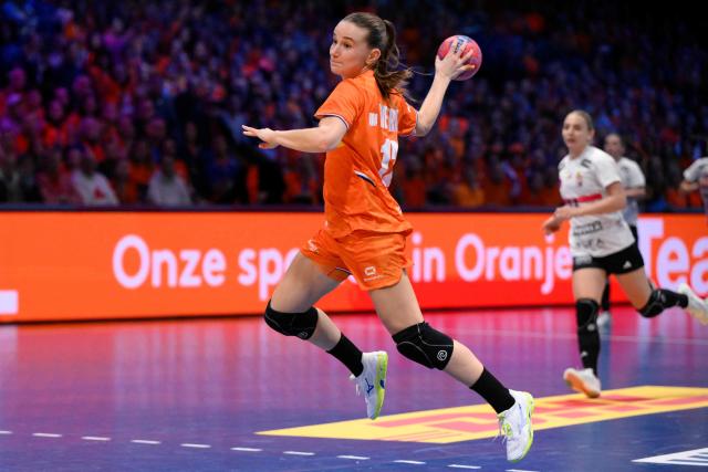 Netherlands' left wing #12 Bo van Wetering shoots during the quarter finals match between the Netherlands and Hungary of the IHF Women's Handball World Championship in Rotterdam Ahoy, in Rotterdam on December 10, 2025. (Photo by JOHN THYS / AFP)