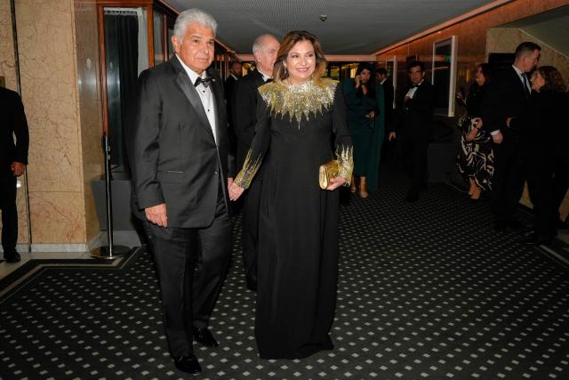 Panama's President Jose Raul Mulino (L) and his wife Maricel Cohen de Mulino arrive for the Nobel banquet at the Grand Hotel in Oslo, Norway, on December 10, 2025. (Photo by Lise Åserud / NTB / AFP) / Norway OUT