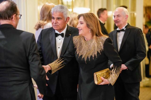 Panama's President Jose Raul Mulino (L) and his wife Maricel Cohen de Mulino arrive for the Nobel Prize banquet at the Grand Hotel in Oslo, Norway, on December 10, 2025. The 2025 Nobel Peace Prize was awarded to Maria Corina Machado for her efforts to bring democracy to Venezuela, challenging the iron-fisted rule of Venezuelan President Nicolas Maduro, who has been president since 2013. (Photo by Cornelius Poppe / NTB / AFP) / Norway OUT