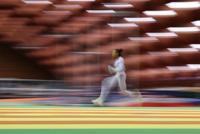 French sprinter Pamera Losange, deaf since birth and the French Elite 200m champion among able-bodied athletes, runs during a training session at France’s National Institute of Sport, Expertise, and Performance (INSEP) after winning two gold medals at the recent Tokyo 2025 Deaflympics (the Olympic Games for deaf and hard-of-hearing athletes), in Paris on December 10, 2025. (Photo by Anne-Christine POUJOULAT / AFP)