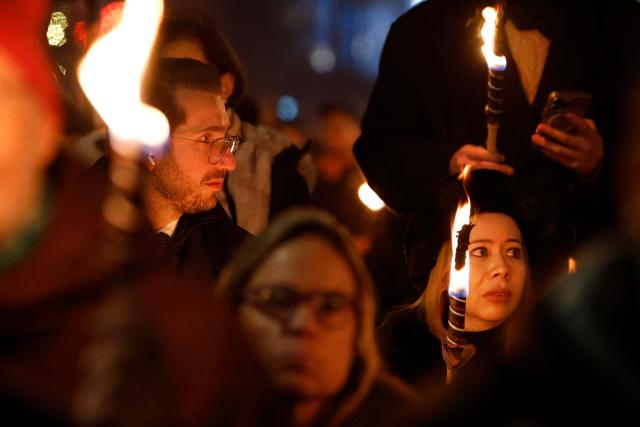 People hold torches as they take part in a torchlight procession organized by the Norwegian Venezuelan Justice Alliance in honor of Nobel Peace Prize laureate Maria Corina Machado in Oslo, Norway, on December 10, 2025. The daughter of the Nobel Peace Prize laureate, Ana Corina Sosa, accepted the award on behalf of her mother during a ceremony at Oslo City Hall. Venezuelan opposition leader Maria Corina Machado received the award for her tireless work to secure democratic rights for the people of Venezuela, and for her fight for a just and peaceful transition from dictatorship to popular rule. Due to the circumstances in her home country of Venezuela, the Nobel Peace Prize laureate was unable to attend the award ceremony in Norway. (Photo by Odd ANDERSEN / AFP) / Norway OUT