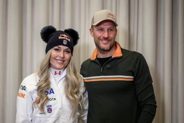 US Lindsey Vonn (L) poses with her coach, former Norwegian skier Aksel Lund Svindal (R) during a press conference ahead of speed skiing races as part of the FIS Alpine ski World Cup 2025-2026, in St. Moritz on December 10, 2025. (Photo by Fabrice COFFRINI / AFP)