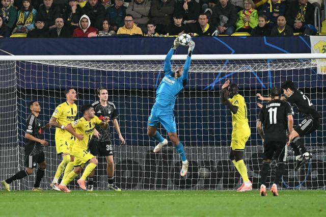 Villarreal's Brazilian goalkeeper #01 Luiz Junior deflects the ball during the UEFA Champions League league phase day 6 football match between Villarreal CF and FC Copenhagen at La Ceramica Stadium in Vila-real on December 10, 2025. (Photo by JOSE JORDAN / AFP)
