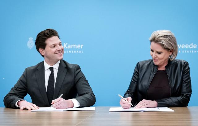 Rianne Letschert (R) is received by Speaker of the House of Representatives Thom van Campen in the Writing Room at the House of Representatives, in The Hague on December 10, 2025. Letschert has been nominated by the House of Representatives to continue the coalition formation process. (Photo by Remko de Waal / ANP / AFP) / Netherlands OUT