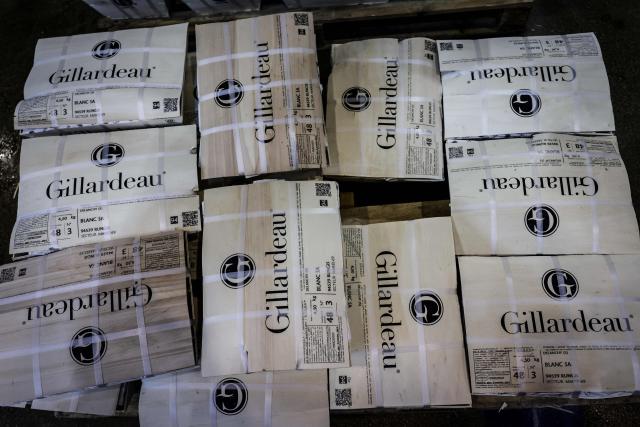 This photograph taken on December 10, 2025 shows hampers of Gillardeau oysters displayed at the fish pavilion of the Rungis International Market, in Rungis, south outskirts of Paris. The world's leading fresh produce market, Rungis International Market covers 234 hectares, with 1,200 companies, 13,000 workers, 3 million tons of goods, and sales of 10 billion euros, of which fruit and vegetables account for the largest share. (Photo by STEPHANE DE SAKUTIN / AFP)