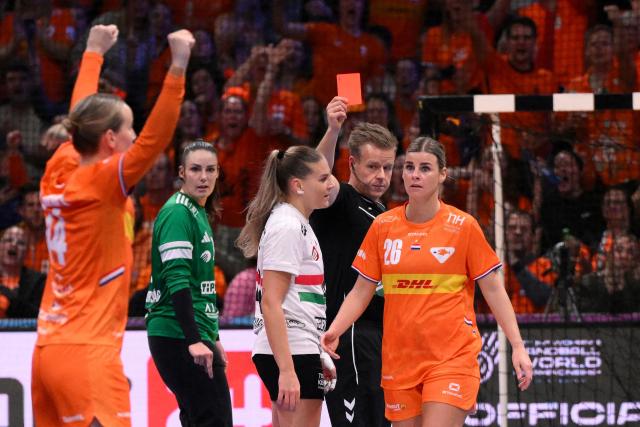 Hungary's right back #42 Katrin Klujber (C) receives a red card during the quarter finals match between the Netherlands and Hungary of the IHF Women's Handball World Championship in Rotterdam Ahoy, in Rotterdam on December 10, 2025. (Photo by JOHN THYS / AFP)