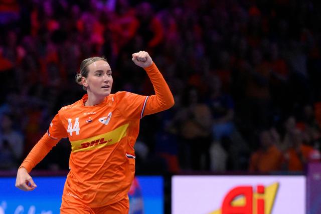 Netherlands' pivot #44 Nikita van der Vliet celebrates after scoring during the quarter finals match between the Netherlands and Hungary of the IHF Women's Handball World Championship in Rotterdam Ahoy, in Rotterdam on December 10, 2025. (Photo by JOHN THYS / AFP)