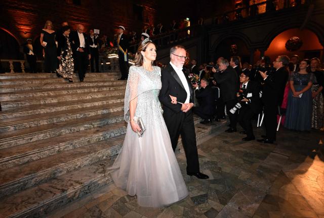 Nobel Prize in Physiology or Medicine 2025 laureate US immunologist Fred Ramsdell and Princess Madeleine of Sweden arrive to attend the Nobel Prize banquet on December 10, 2025 at the City Hall in Stockholm, Sweden. The laureates received their prizes at formal ceremonies in Stockholm and Oslo on December 10. That date is the anniversary of the death in 1896 of scientist Alfred Nobel, who created the prizes in his will. (Photo by Jonathan Nackstrand / AFP)