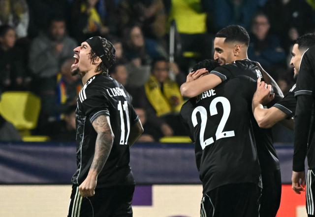 FC Copenhagen's Tunisian forward #30 Elias Achouri (2R) celebrates scoring his team's second goal with teammates during the UEFA Champions League league phase day 6 football match between Villarreal CF and FC Copenhagen at La Ceramica Stadium in Vila-real on December 10, 2025. (Photo by JOSE JORDAN / AFP)