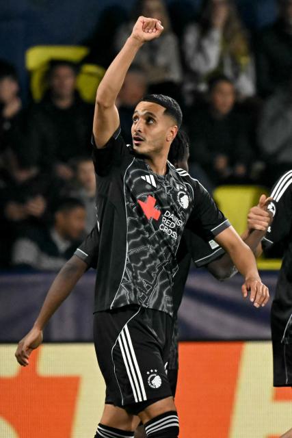 FC Copenhagen's Tunisian forward #30 Elias Achouri celebrates scoring his team's second goal with teammates during the UEFA Champions League league phase day 6 football match between Villarreal CF and FC Copenhagen at La Ceramica Stadium in Vila-real on December 10, 2025. (Photo by JOSE JORDAN / AFP)