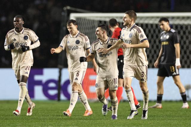Ajax's Israeli midfielder #10 Oscar Gloukh celebrates after scoring the team's second goal during the UEFA Champions League league phase football match between Qarabag and Ajax at the Tofiq Bahramov Republican Stadium in Baku on December 10, 2025. (Photo by Giorgi ARJEVANIDZE / AFP)