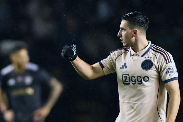 Ajax's Israeli midfielder #10 Oscar Gloukh celebrates after scoring the team's second goal during the UEFA Champions League league phase football match between Qarabag and Ajax at the Tofiq Bahramov Republican Stadium in Baku on December 10, 2025. (Photo by Giorgi ARJEVANIDZE / AFP)