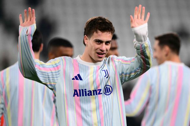 Juventus' Turkish forward #10 Kenan Yildiz greets supporters during warm up ahead of the UEFA Champions League - league phase day 6 football match between Juventus and Pafos FC at the Allianz stadium in Turin, on December 10, 2025. (Photo by Marco BERTORELLO / AFP)