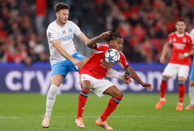 Napoli's Kosovo defender #13 Amir Rrahmani and Benfica's Luxembourgers midfielder #18 Leandro Barreiro fight for the ball during the UEFA Champions League league phase day 6 football match between SL Benfica and Napoli at Estadio da Luz in Lisbon on December 10, 2025. (Photo by FILIPE AMORIM / AFP)