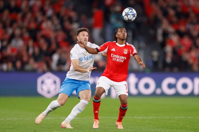 Napoli's Kosovo defender #13 Amir Rrahmani and Benfica's Luxembourgers midfielder #18 Leandro Barreiro fight for the ball during the UEFA Champions League league phase day 6 football match between SL Benfica and Napoli at Estadio da Luz in Lisbon on December 10, 2025. (Photo by FILIPE AMORIM / AFP)