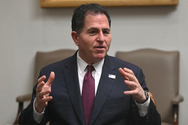 CEO of Dell Technologies Michael Dell speaks during a roundtable discussion with the US president in the Roosevelt Room of the White House in Washington, DC, on December 10, 2025. (Photo by ANDREW CABALLERO-REYNOLDS / AFP)