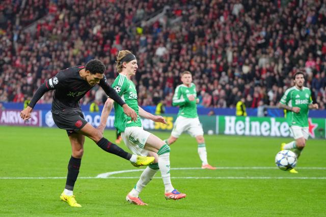 Bayer Leverkusen's English defender #04 Jarell Quansah misses an attempt to score during the UEFA Champions League league phase - matchday 6, football match between Bayer Leverkusen and Newcastle United FC at the BayArena stadium in Leverkusen, western Germany on December 10, 2025. (Photo by Pau Barrena / AFP)