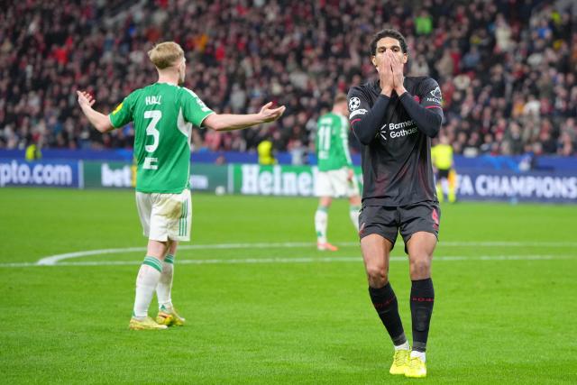 Bayer Leverkusen's English defender #04 Jarell Quansah reacts after missing an attempt to score during the UEFA Champions League league phase - matchday 6, football match between Bayer Leverkusen and Newcastle United FC at the BayArena stadium in Leverkusen, western Germany on December 10, 2025. (Photo by Pau Barrena / AFP)