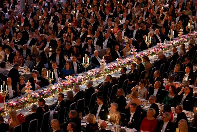 General overview shows laureates and guests attending the Nobel Prize banquet on December 10, 2025 at the City Hall in Stockholm, Sweden. The laureates received their prizes at formal ceremonies in Stockholm and Oslo on December 10. That date is the anniversary of the death in 1896 of scientist Alfred Nobel, who created the prizes in his will. (Photo by Jonathan Nackstrand / AFP)