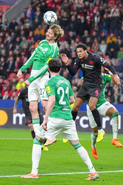 Newcastle United's German striker #27 Nick Woltemade heads the ball during the UEFA Champions League league phase - matchday 6, football match between Bayer Leverkusen and Newcastle United FC at the BayArena stadium in Leverkusen, western Germany on December 10, 2025. (Photo by Pau Barrena / AFP)