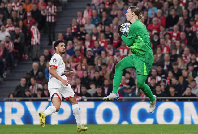 Paris Saint-Germain's Russian goalkeeper #39 Matvey Safonov jumps for the ball during the UEFA Champions League league phase day 6 football match between Athletic Club Bilbao and Paris Saint-Germain (PSG) at San Mames Stadium in Bilbao on December 10, 2025. (Photo by Cesar MANSO / AFP)