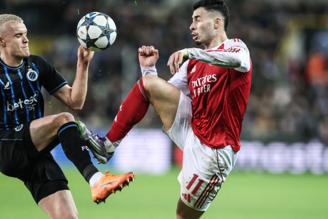 EDITORS NOTE: Graphic content / Club's Hugo Siquet fights for the ball with Arsenal's Brazilian forward #11 Gabriel Martinelli during the UEFA football match between Club Brugge KV and goal Arsenal F.C in Brugge on December 10, 2025. (Photo by BRUNO FAHY / Belga / AFP) / Belgium OUT