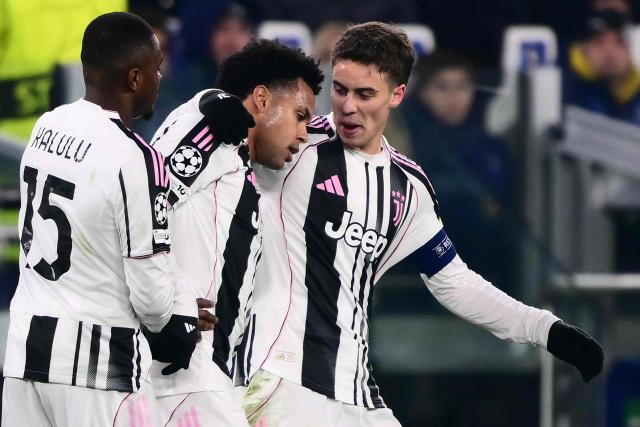 Juventus' US midfielder #22 Weston McKennie (C) celebrates scoring his team's first goal with Juventus' French defender #15 Pierre Kalulu Kyatengwa (L) and Juventus' Turkish forward #10 Kenan Yildiz during the UEFA Champions League - league phase day 6 football match between Juventus and Pafos FC at the Allianz stadium in Turin, on December 10, 2025. (Photo by Marco BERTORELLO / AFP)