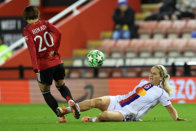 Lyon's US midfielder #10 Lindsey Horan (R) tackles Manchester United's Japanese midfielder #20 Hinata Miyazawa during the UEFA Women's Champions League, league phase football match between Manchester United and OL Lyonnes at the Progress With Unity Stadium in Leigh, western Manchester, on December 10, 2025. (Photo by Darren Staples / AFP)