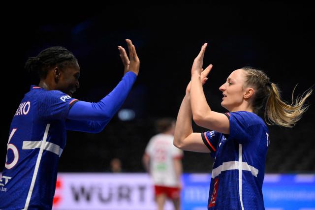 France's right wing #03 Alicia Toublanc (R) celebrates with France's left back #96 Fatou Karamoko during the quarter finals match between Denmark and France of the IHF Women's Handball World Championship in Rotterdam Ahoy, in Rotterdam on December 10, 2025. (Photo by JOHN THYS / AFP)