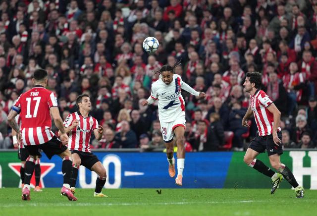 Paris Saint-Germain's French forward #29 Bradley Barcola heads the ball during the UEFA Champions League league phase day 6 football match between Athletic Club Bilbao and Paris Saint-Germain (PSG) at San Mames Stadium in Bilbao on December 10, 2025. (Photo by Cesar MANSO / AFP)
