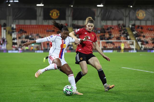 Manchester United's Dutch defender #17 Dominique Janssen (R) defends from Lyon's French forward #11 Kadidiatou Diani during the UEFA Women's Champions League, league phase football match between Manchester United and OL Lyonnes at the Progress With Unity Stadium in Leigh, western Manchester, on December 10, 2025. (Photo by Darren Staples / AFP)