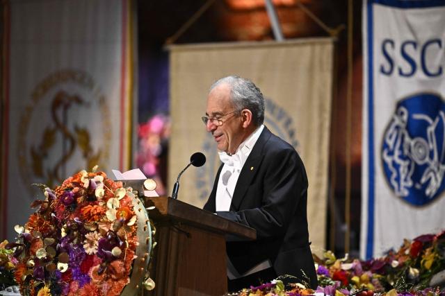 Nobel Prize in Physics 2025 laureate French physicist Michel H Devoret addresses a speech at the end of the Nobel Prize banquet on December 10, 2025 at the City Hall in Stockholm, Sweden. The laureates received their prizes at formal ceremonies in Stockholm and Oslo on December 10. That date is the anniversary of the death in 1896 of scientist Alfred Nobel, who created the prizes in his will. (Photo by Christine Olsson/TT / TT News Agency / AFP) / Sweden OUT