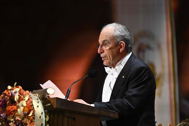Nobel Prize in Physics 2025 laureate French physicist Michel H Devoret addresses a speech at the end of the Nobel Prize banquet on December 10, 2025 at the City Hall in Stockholm, Sweden. The laureates received their prizes at formal ceremonies in Stockholm and Oslo on December 10. That date is the anniversary of the death in 1896 of scientist Alfred Nobel, who created the prizes in his will. (Photo by Christine Olsson/TT / TT News Agency / AFP) / Sweden OUT