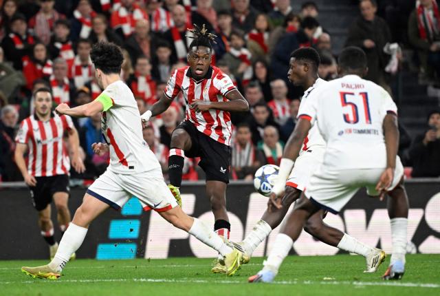 Athletic Bilbao's Spanish forward #10 Nico Williams kicks the ball during the UEFA Champions League league phase day 6 football match between Athletic Club Bilbao and Paris Saint-Germain (PSG) at San Mames Stadium in Bilbao on December 10, 2025. (Photo by ANDER GILLENEA / AFP)