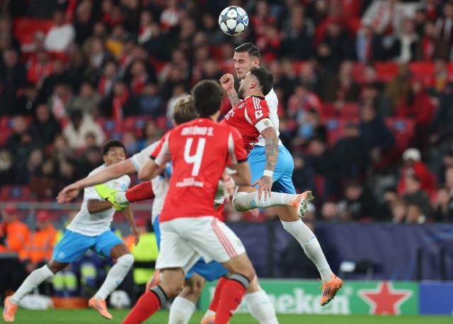Benfica's Argentine defender #30 Nicolas Otamendi and Napoli's Italian forward #27 Lorenzo Lucca fight for the ball during the UEFA Champions League league phase day 6 football match between SL Benfica and Napoli at Estadio da Luz in Lisbon on December 10, 2025. (Photo by PATRICIA DE MELO MOREIRA / AFP)