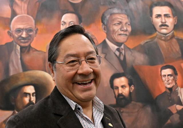 (FILES) Bolivia's President Luis Arce Catacora smiles during an interview with AFP at the Casa Grande del Pueblo in La Paz on June 18, 2025. Bolivia's former president Luis Arce was arrested on December 10, 2025, by police officers in La Paz after prosecutors launched an investigation into an alleged corruption case dating back to his time as minister under former president Evo Morales (2006-2019), the government said. (Photo by AIZAR RALDES / AFP)
