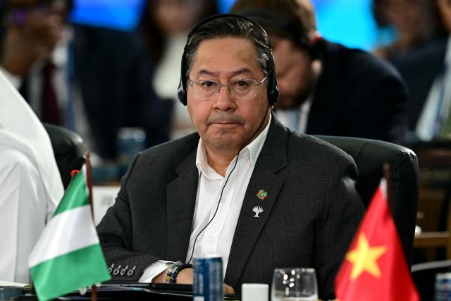 (FILES) Bolivia's President Luis Arce Catacora attends the BRICS summit second plenary session in Rio de Janeiro, Brazil, on July 6, 2025. Bolivia's former president Luis Arce was arrested on December 10, 2025, by police officers in La Paz after prosecutors launched an investigation into an alleged corruption case dating back to his time as minister under former president Evo Morales (2006-2019), the government said. (Photo by Pablo PORCIUNCULA / AFP)