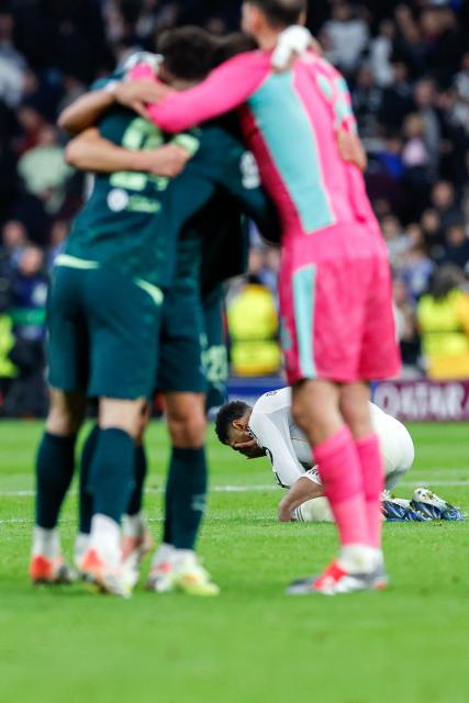 Real Madrid's English midfielder #05 Jude Bellingham reacts after the UEFA Champions League league phase day 6 football match between Real Madrid CF and Manchester City at Santiago Bernabeu Stadium in Madrid on December 10, 2025. (Photo by Oscar DEL POZO / AFP)