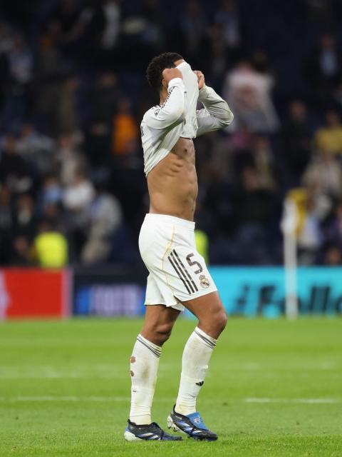 Real Madrid's English midfielder #05 Jude Bellingham reacts after the UEFA Champions League league phase day 6 football match between Real Madrid CF and Manchester City at Santiago Bernabeu Stadium in Madrid on December 10, 2025. (Photo by Thomas COEX / AFP)